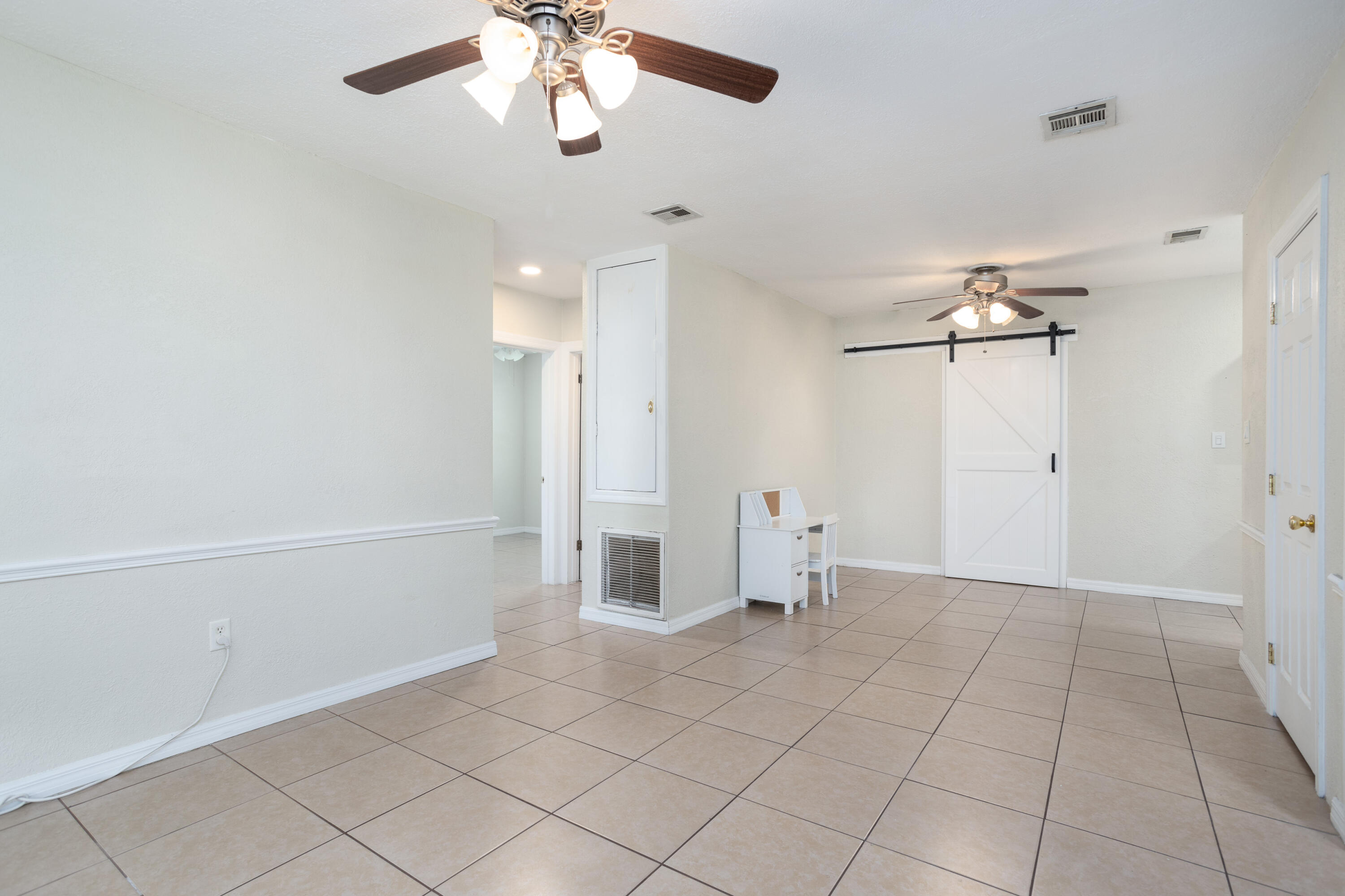 319 West Rutgers Street Melbourne, FL 32901 - Photo 4 of 19 an empty room with closet and a chandelier fan