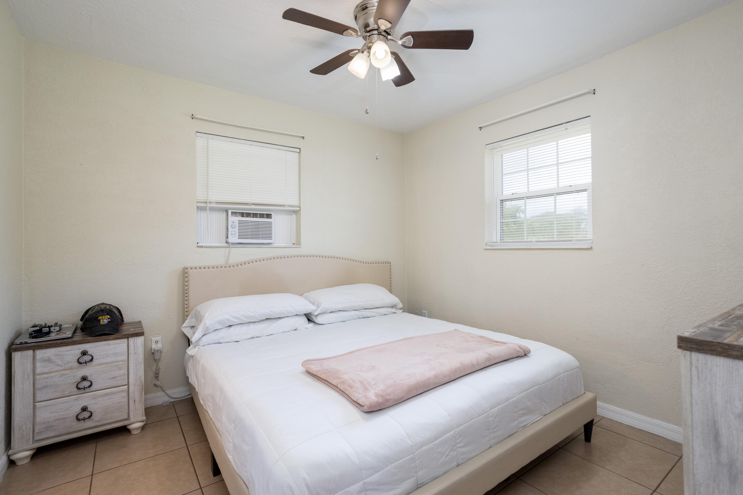 319 West Rutgers Street Melbourne, FL 32901 - Photo 7 of 19 a bedroom with a bed and a window