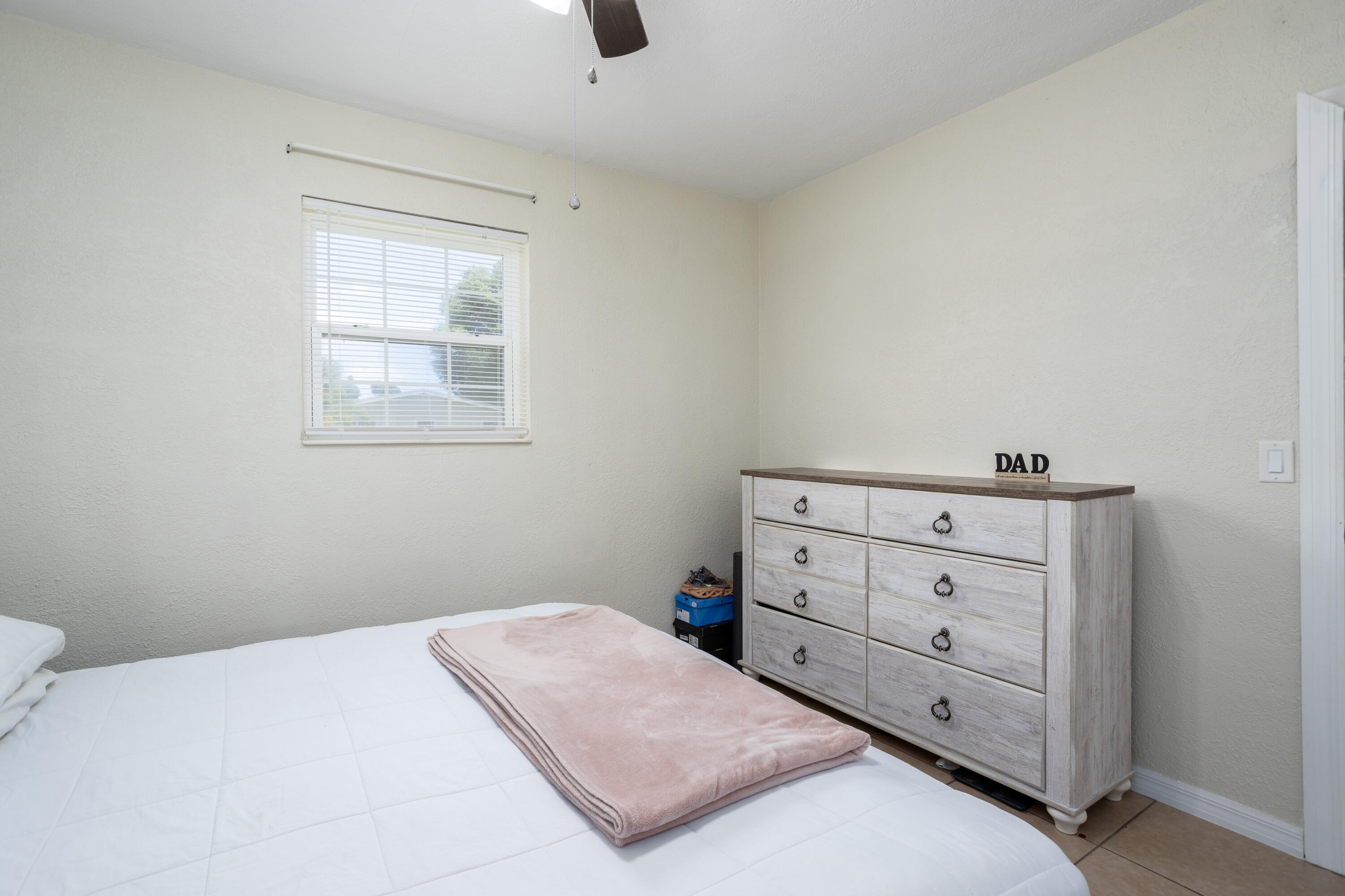 319 West Rutgers Street Melbourne, FL 32901 - Photo 8 of 19 a bedroom with a bed and a window