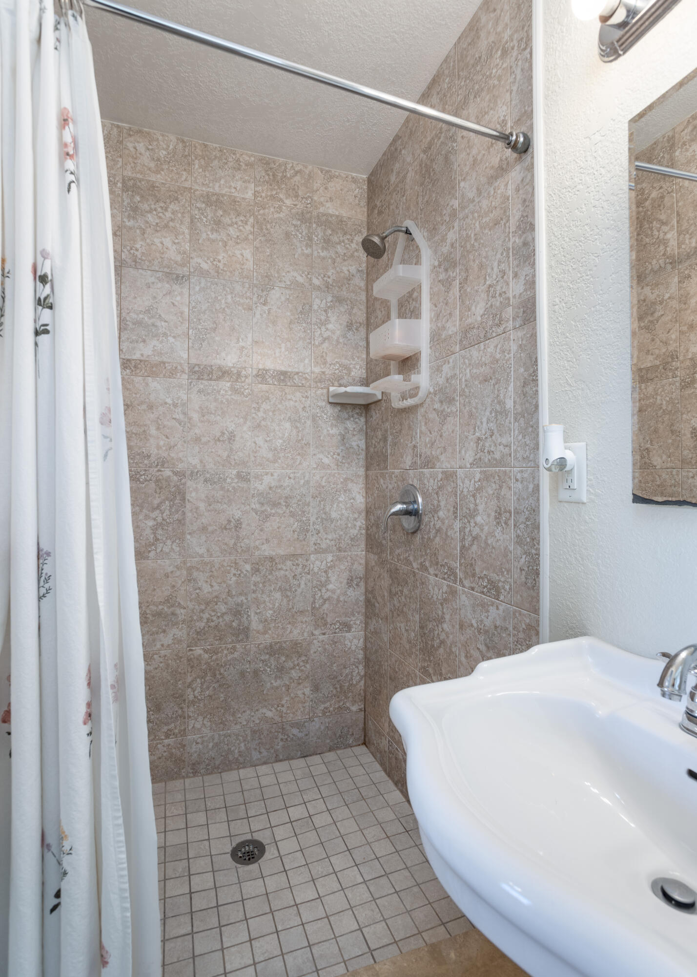 319 West Rutgers Street Melbourne, FL 32901 - Photo 10 of 19 a bathroom with a white shower and a sink
