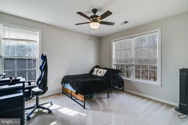 a view of room with window and wooden floor