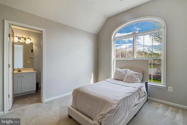 a view of a livingroom with wooden floor and staircase