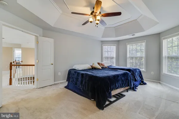a view of a room with wooden floor staircase and a window