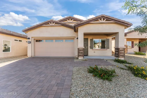 front view of a house with a yard