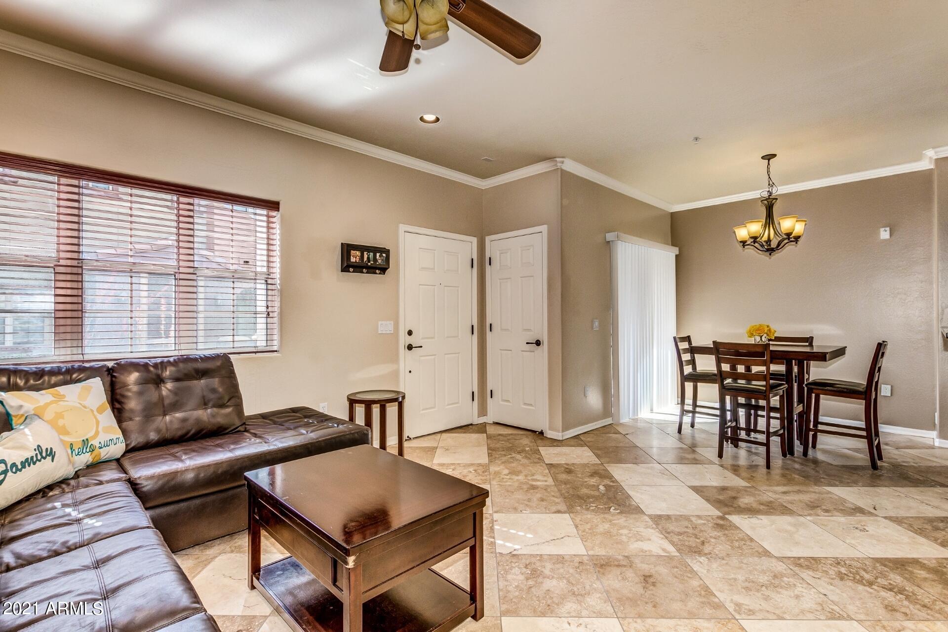 3935 East Rough Rider Road, Unit 1012 Phoenix, AZ 85050 - Photo 11 of 26 Living to Dining