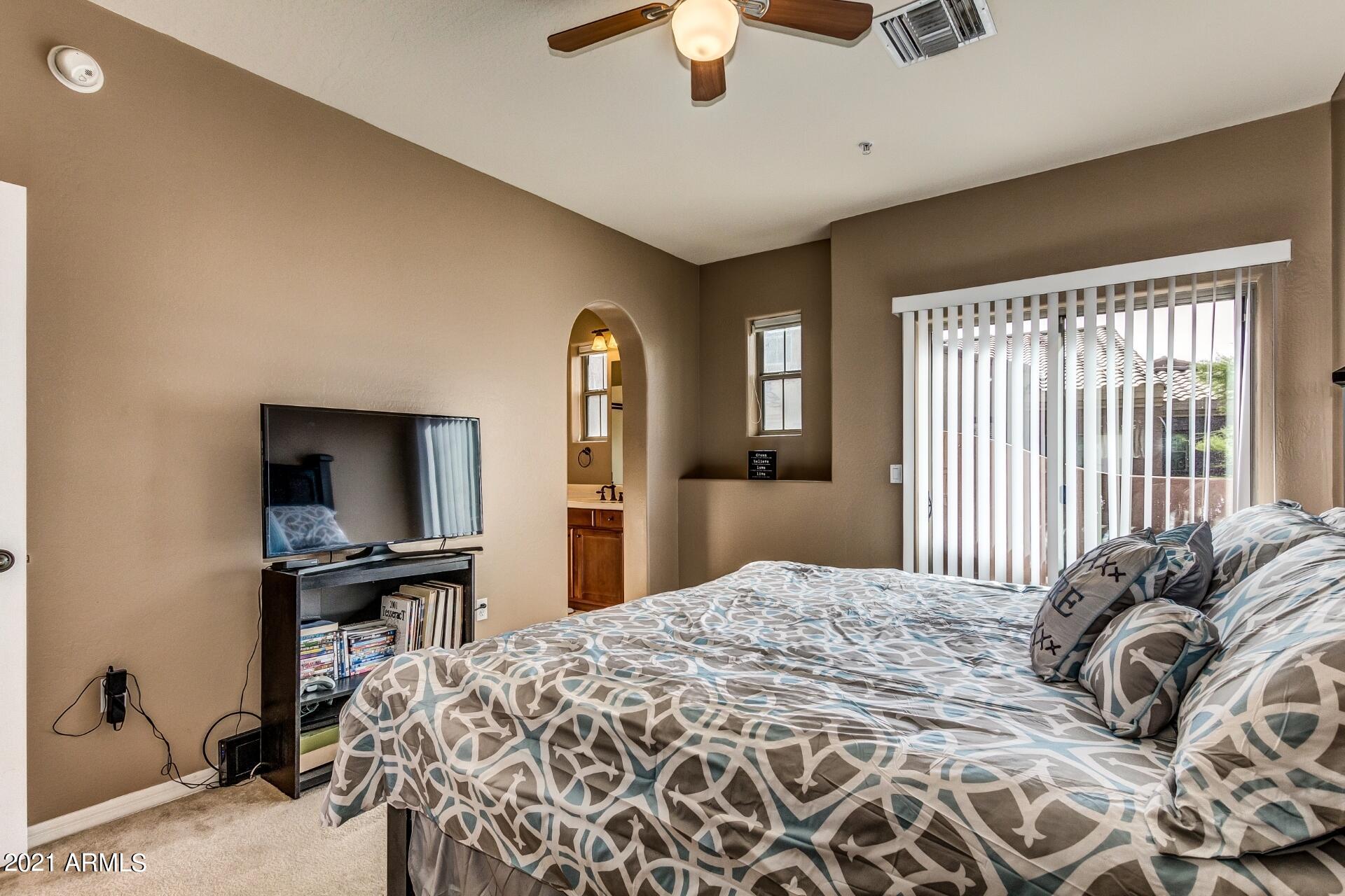 3935 East Rough Rider Road, Unit 1012 Phoenix, AZ 85050 - Photo 14 of 26 Master Bed to Bath