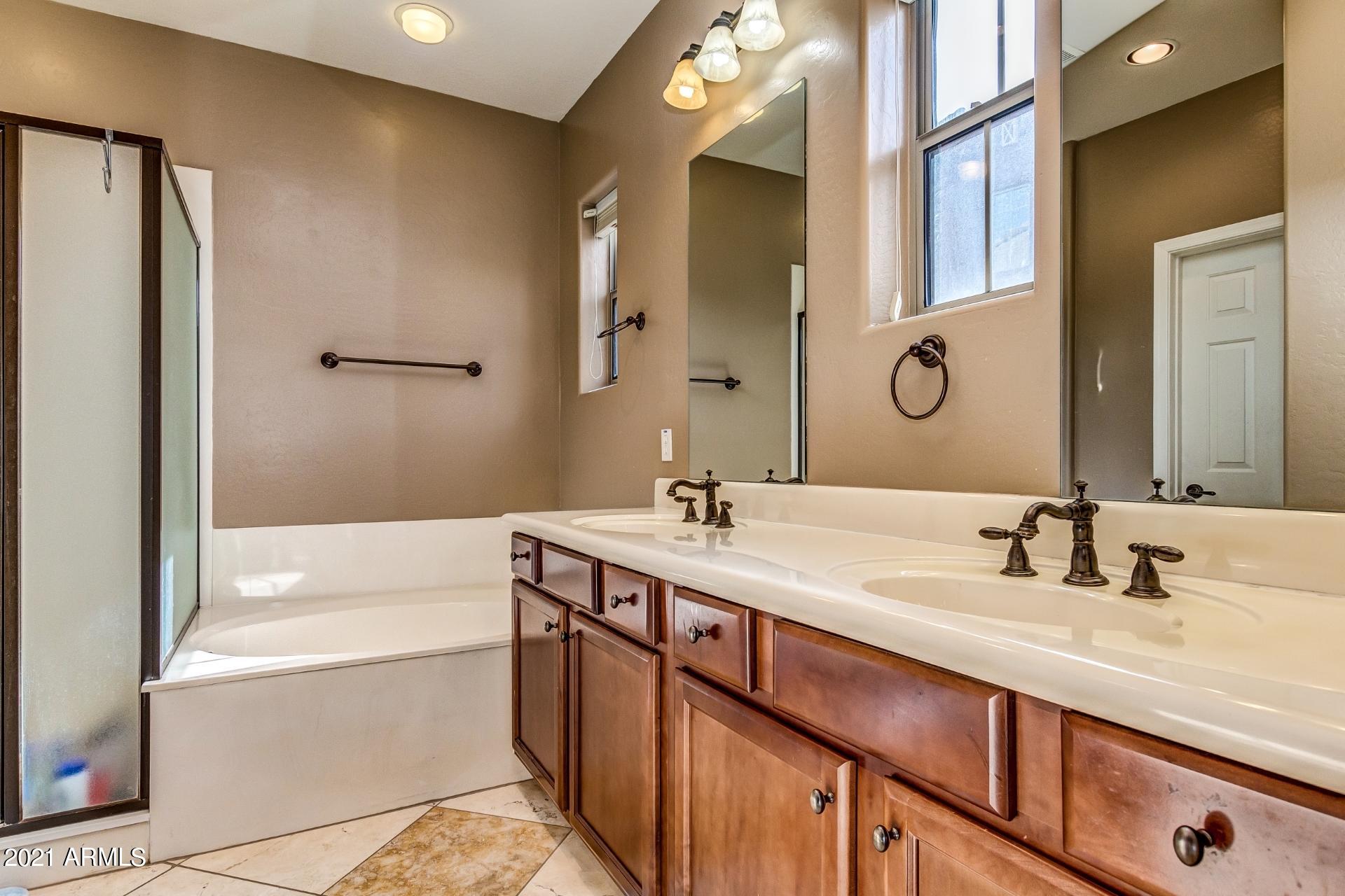 3935 East Rough Rider Road, Unit 1012 Phoenix, AZ 85050 - Photo 15 of 26 Master Sink and Tub