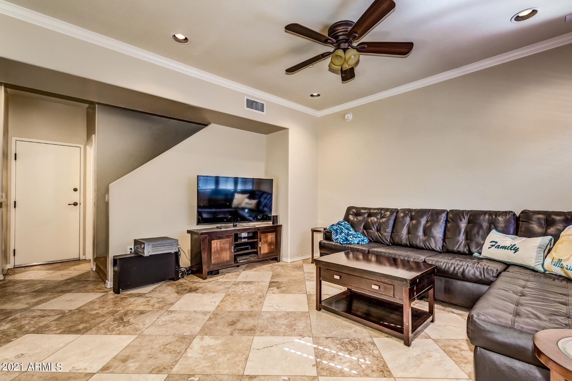 3935 East Rough Rider Road, Unit 1012 Phoenix, AZ 85050 - Photo 7 of 26 Living Room Stairs