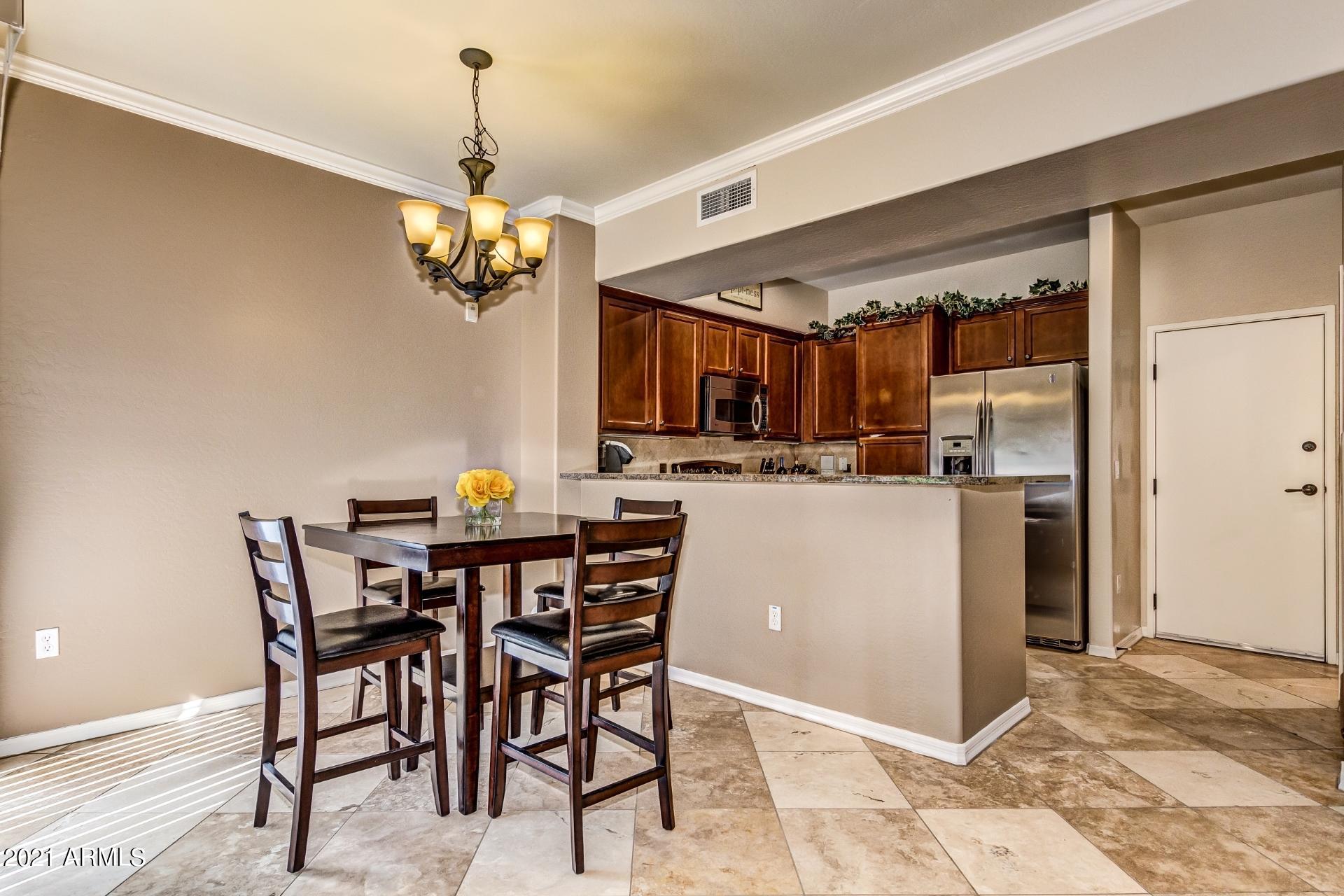 3935 East Rough Rider Road, Unit 1012 Phoenix, AZ 85050 - Photo 8 of 26 Dining to Kitchen