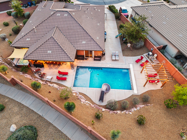 210 Talon Court Ivins, UT 84738 - Photo 48 of 60 View of swimming pool with patio surround and a fenced backyard