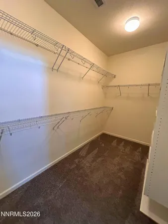 a bathroom with a tub a mirror and a shower