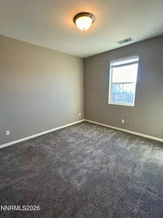 a bathroom with a granite countertop sink toilet a mirror and shower