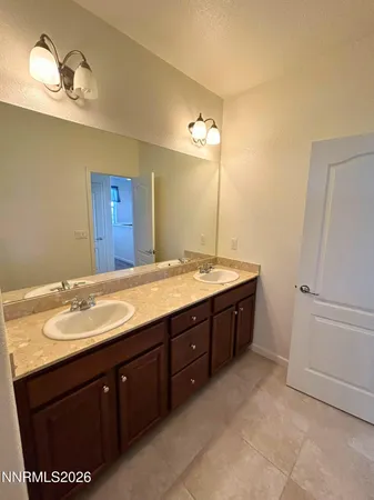 a utility room with sink dryer and washer