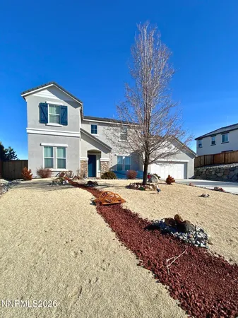 a view of a house with snow on the road