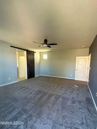 a spacious bathroom with a granite countertop double vanity sink and a mirror