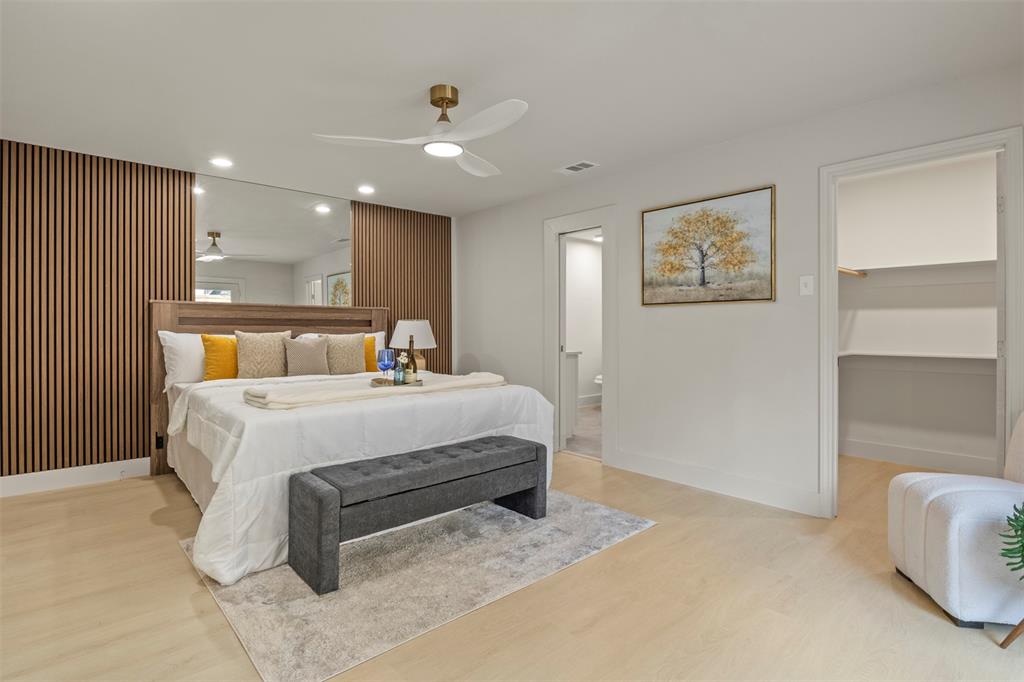 10427 Carry Back Place Dallas, TX 75229 - Photo 1 of 40 a bedroom with a bed and a lamp