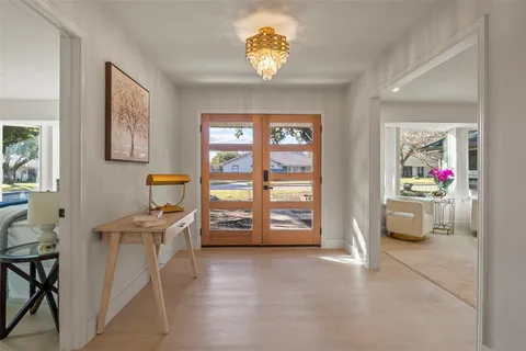 a kitchen with sink and refrigerator
