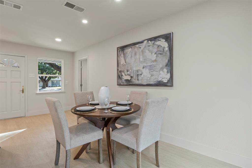 10427 Carry Back Place Dallas, TX 75229 - Photo 18 of 40 a view of a dining room with furniture