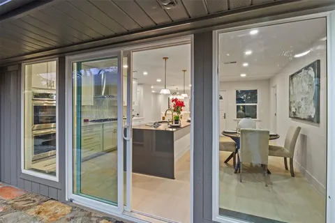 a spacious bedroom with a bed and a painting