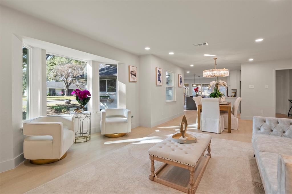 10427 Carry Back Place Dallas, TX 75229 - Photo 2 of 40 a living room with furniture and a flat screen tv