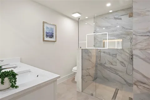 a bathroom with a bathtub and shower