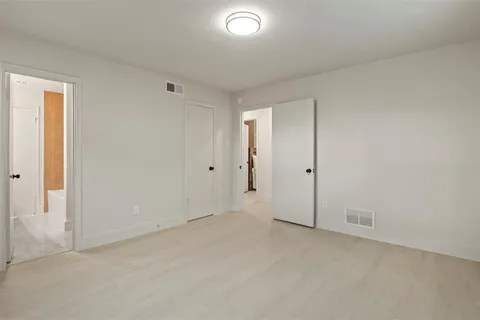 a bathroom with a sink toilet and a mirror