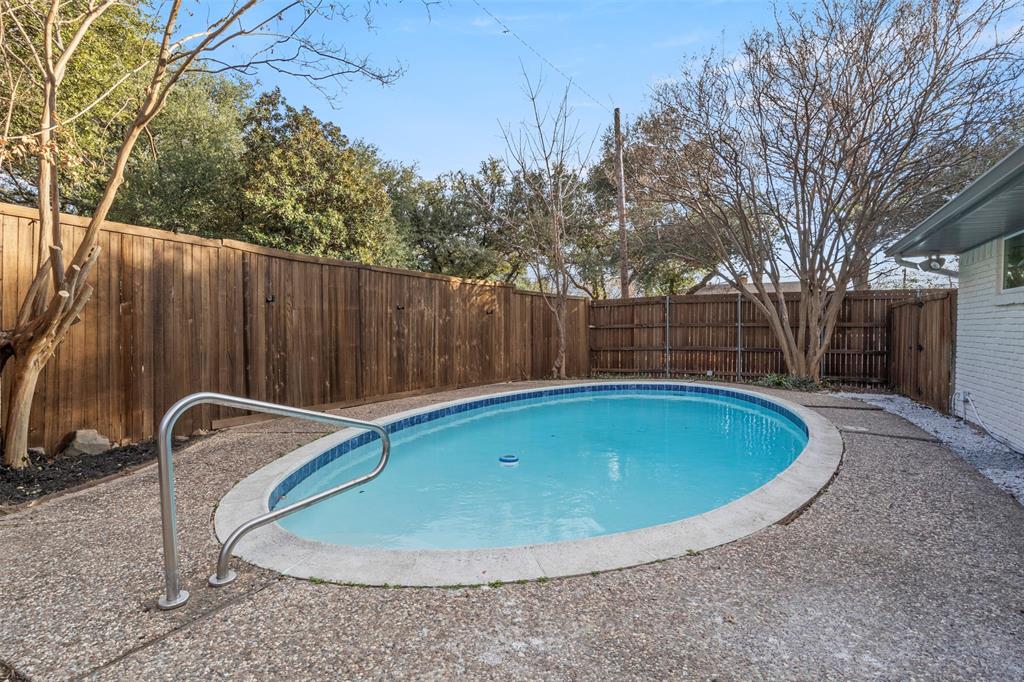 10427 Carry Back Place Dallas, TX 75229 - Photo 37 of 40 a view of a swimming pool in the backyard