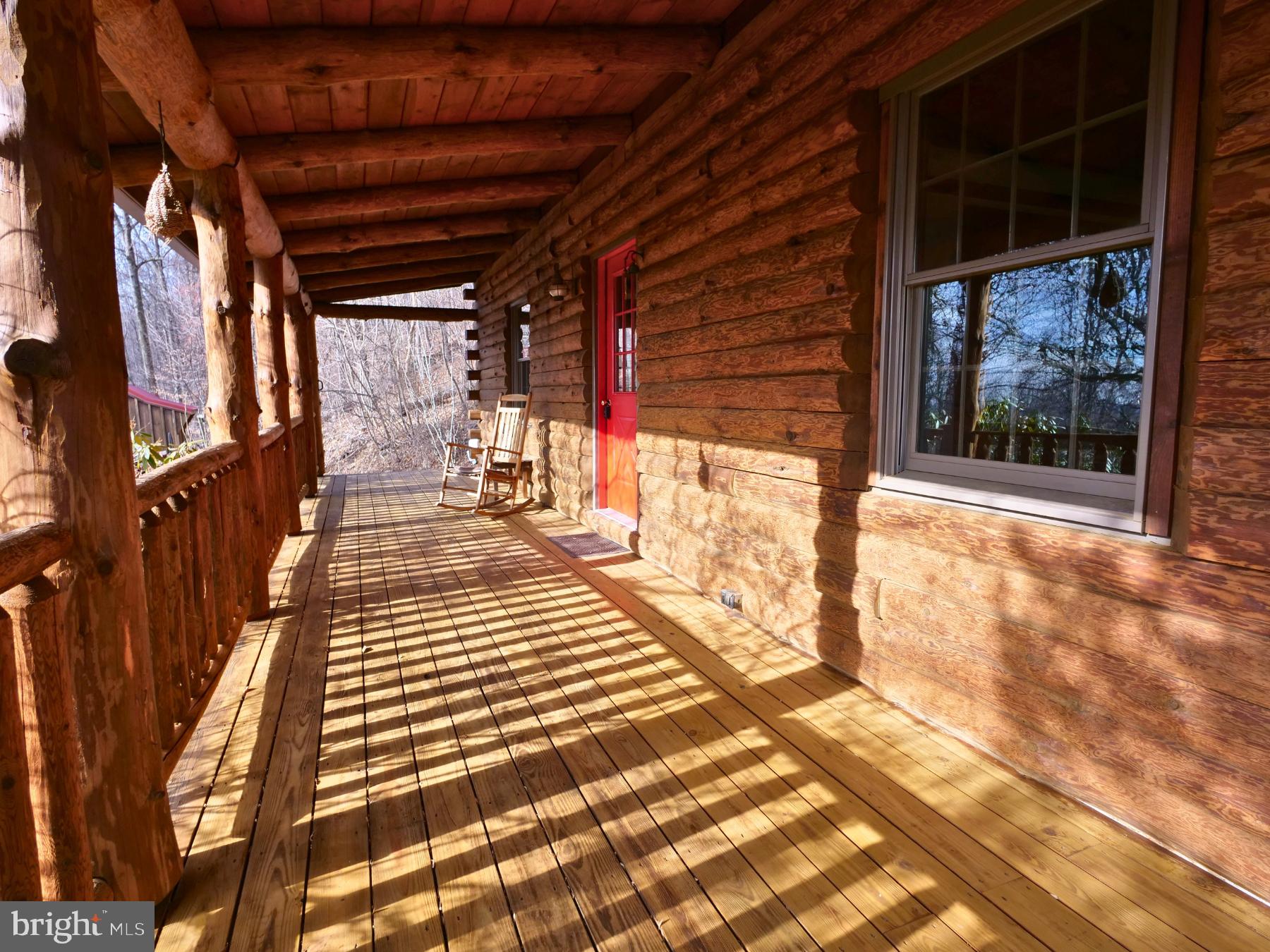 112 Sandy Hill Road Boyertown, PA 19512 - Photo 12 of 37 a view of a porch with wooden floor and a rug