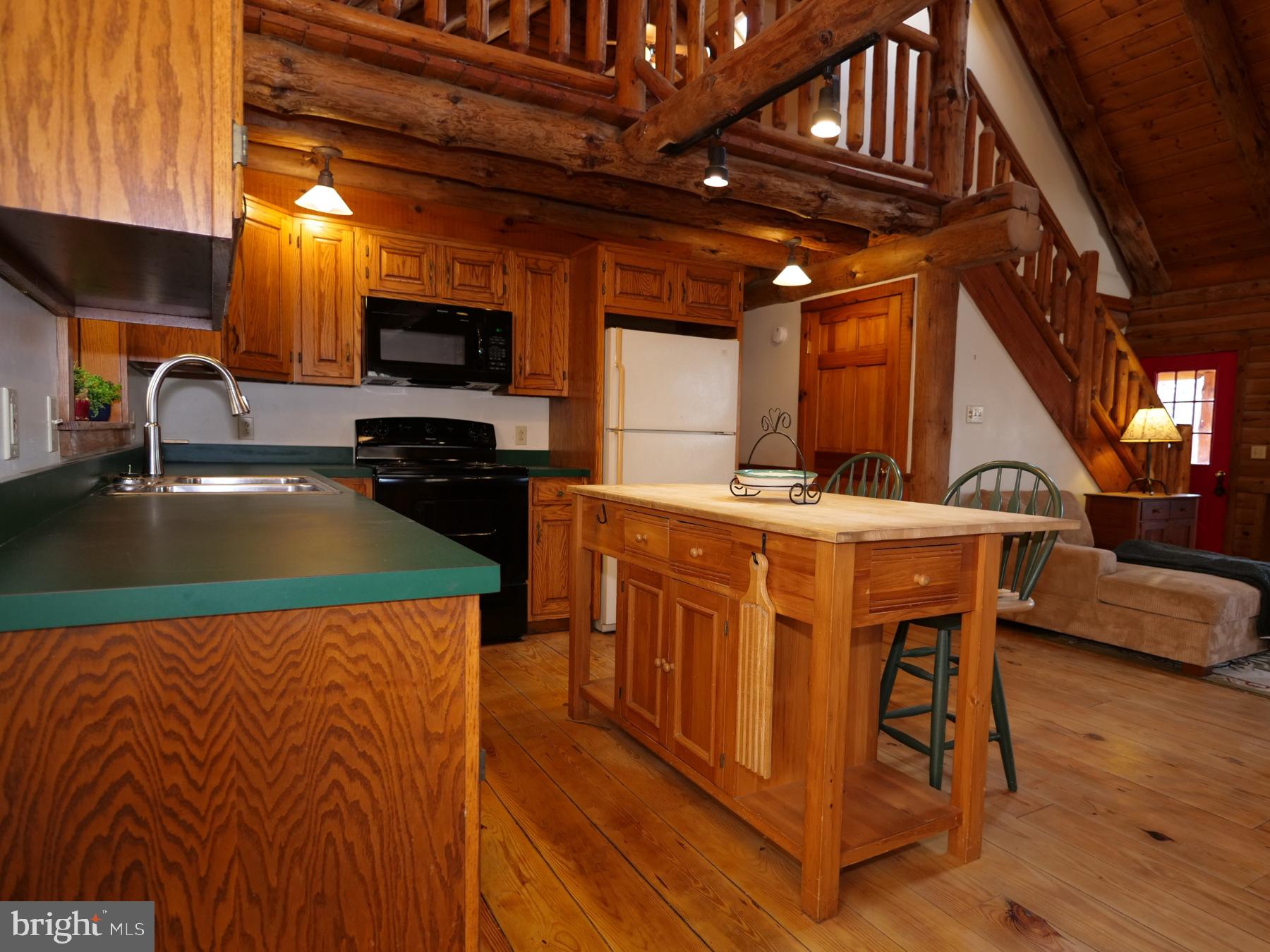 112 Sandy Hill Road Boyertown, PA 19512 - Photo 19 of 37 a kitchen with stainless steel appliances granite countertop a sink a stove and a microwave