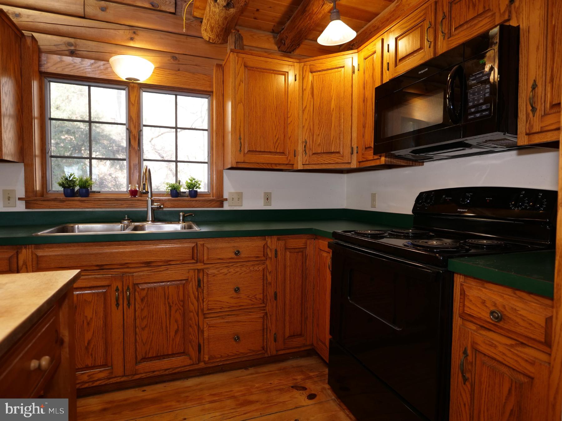 112 Sandy Hill Road Boyertown, PA 19512 - Photo 20 of 37 a kitchen with stainless steel appliances granite countertop a stove a sink and a microwave