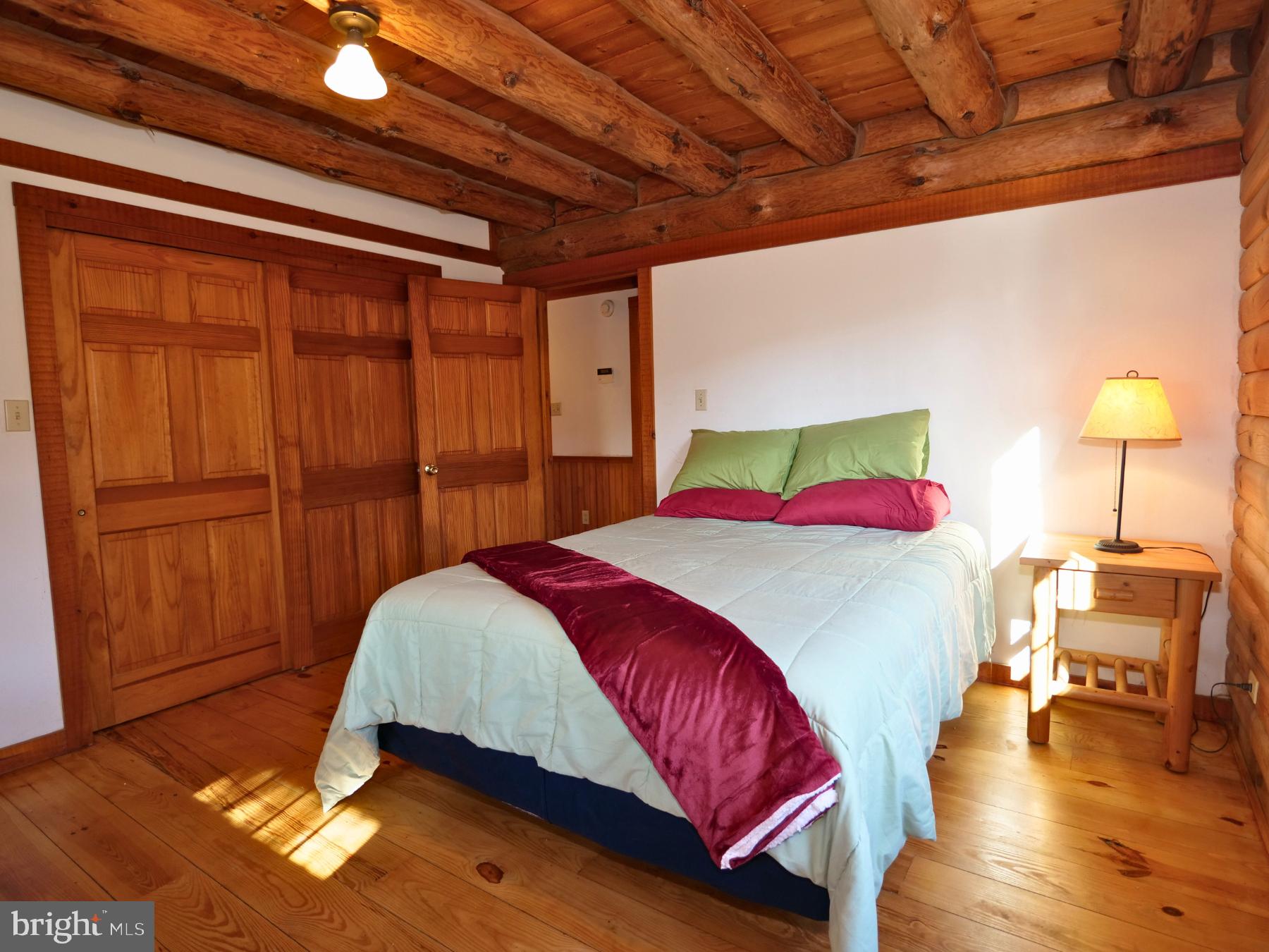 112 Sandy Hill Road Boyertown, PA 19512 - Photo 23 of 37 a bedroom with a bed and wooden floor