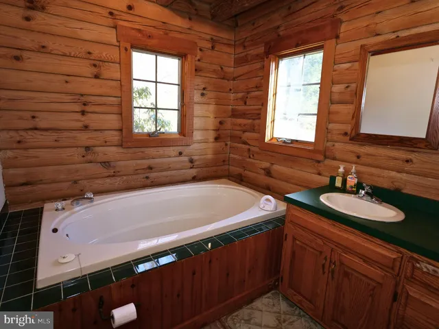a bathroom with a glass shower door