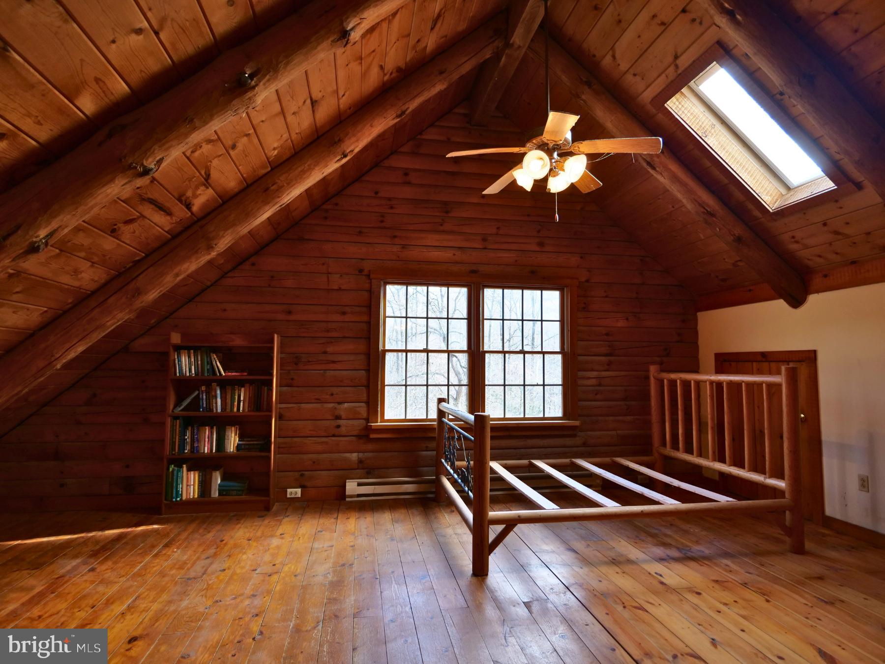 112 Sandy Hill Road Boyertown, PA 19512 - Photo 28 of 37 a room with wooden floors and lots of windows