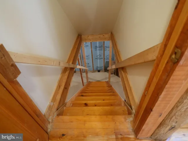 a view of an empty room with windows