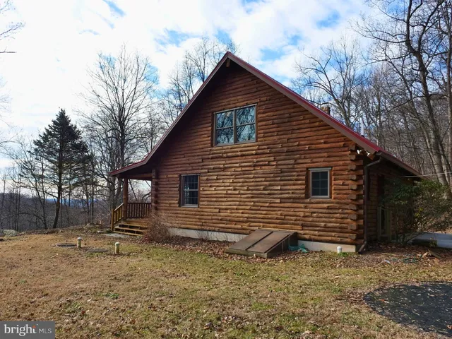a backyard of a house with lots of trees