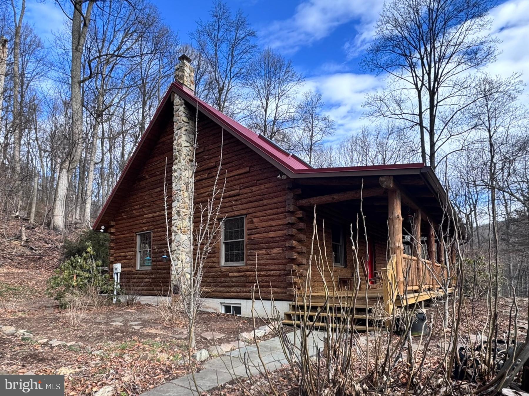 112 Sandy Hill Road Boyertown, PA 19512 - Photo 6 of 37 a view of a house with large windows and a large tree