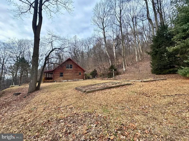 a backyard of a house with large trees