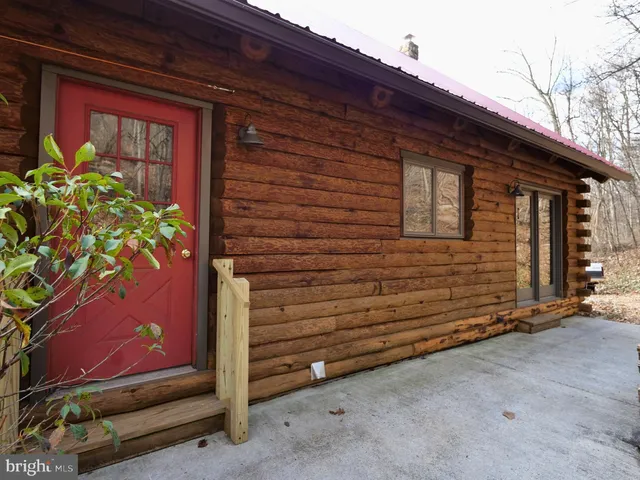 a view of a backyard with sitting area