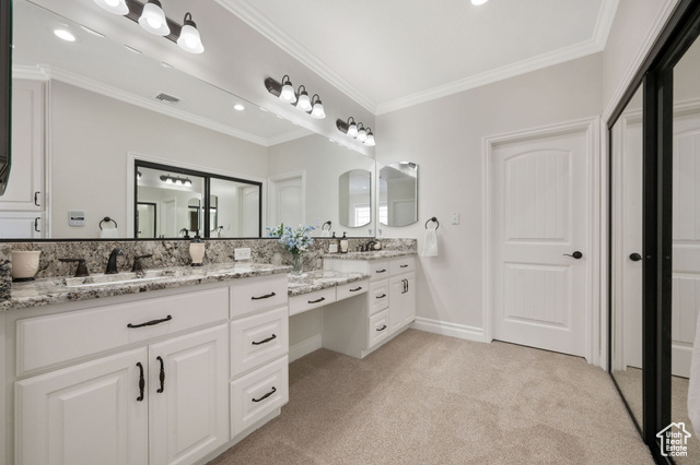 230 Boulder Way Leeds, UT 84746 - Photo 19 of 72 Full master suite bathroom with vanity, ornamental molding, carpet, and recessed lighting plus sliding mirrored ward-robe doors.