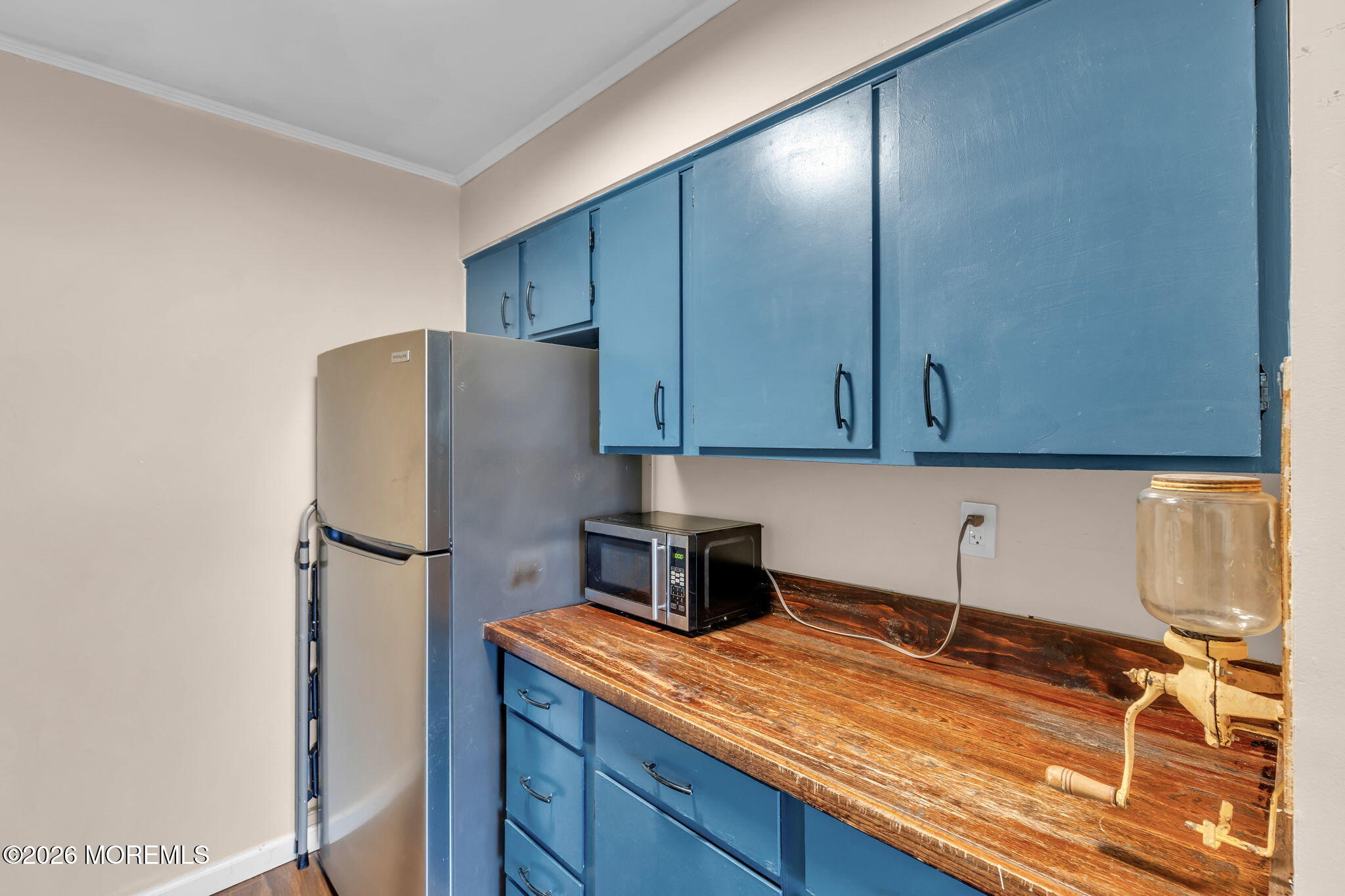 324 Shore Drive, Unit A4 Highlands, NJ 07732 - Photo 5 of 15 a kitchen with a refrigerator and cabinets