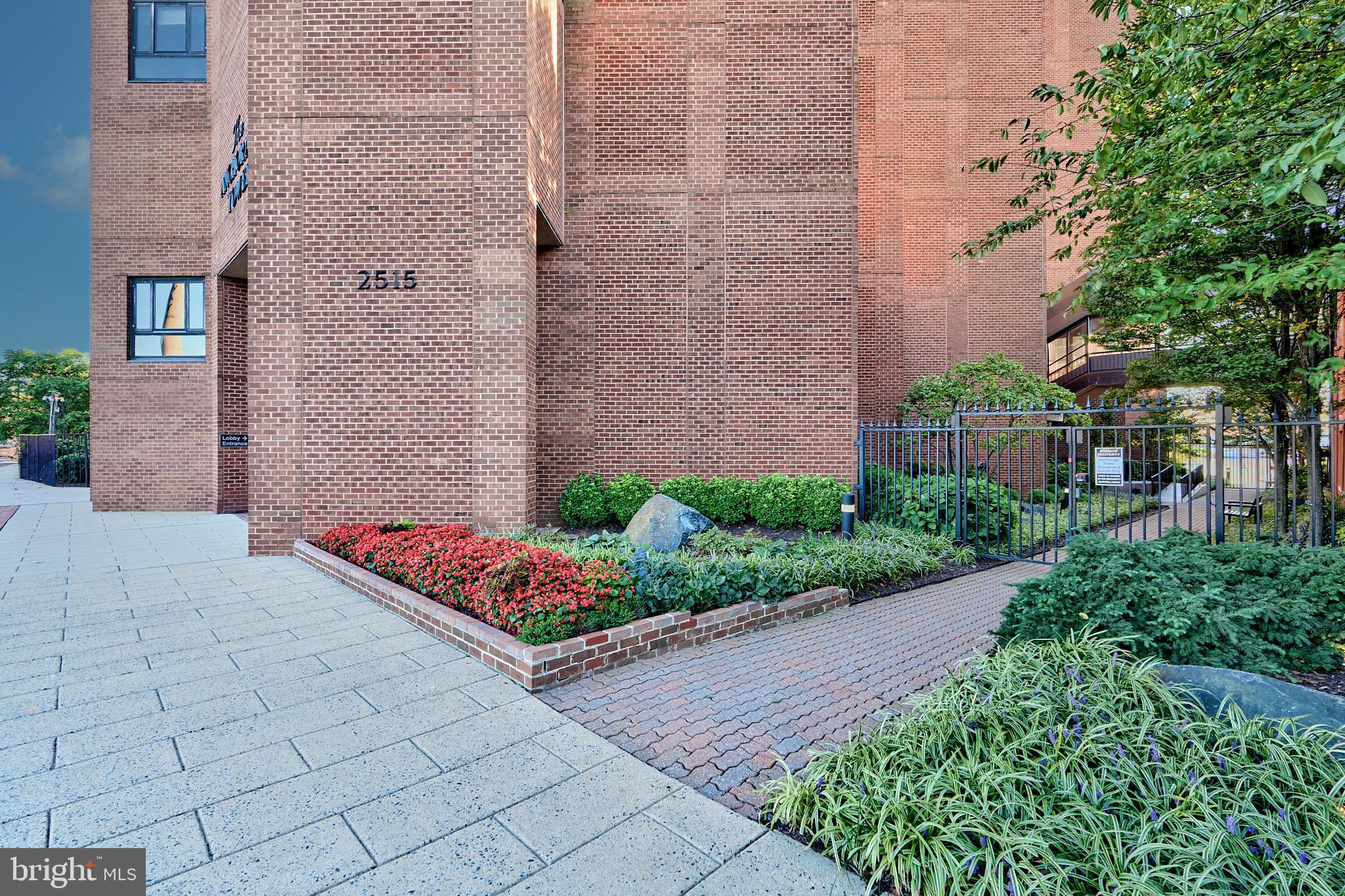 2515 Boston Street, Unit 706 Baltimore, MD 21224 - Photo 20 of 21 a bunch of flowers in front of house