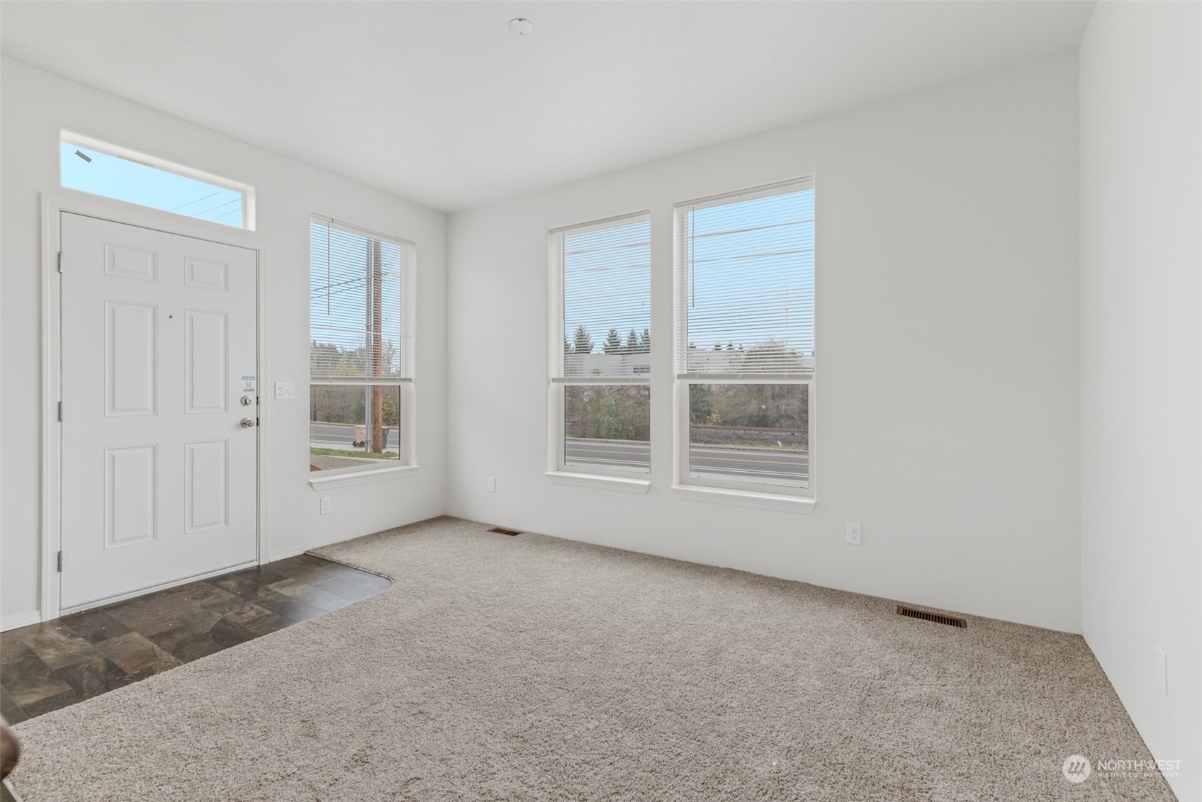 9811 Southwest Herman Road, Unit 45 Tualatin, OR 97062 - Photo 2 of 28 a view of an empty room with a window