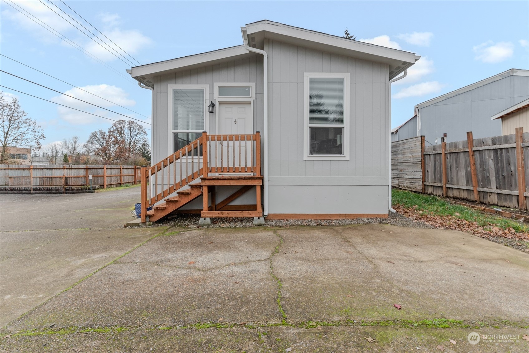 9811 Southwest Herman Road, Unit 45 Tualatin, OR 97062 - Photo 27 of 28 a view of a house with a wooden deck