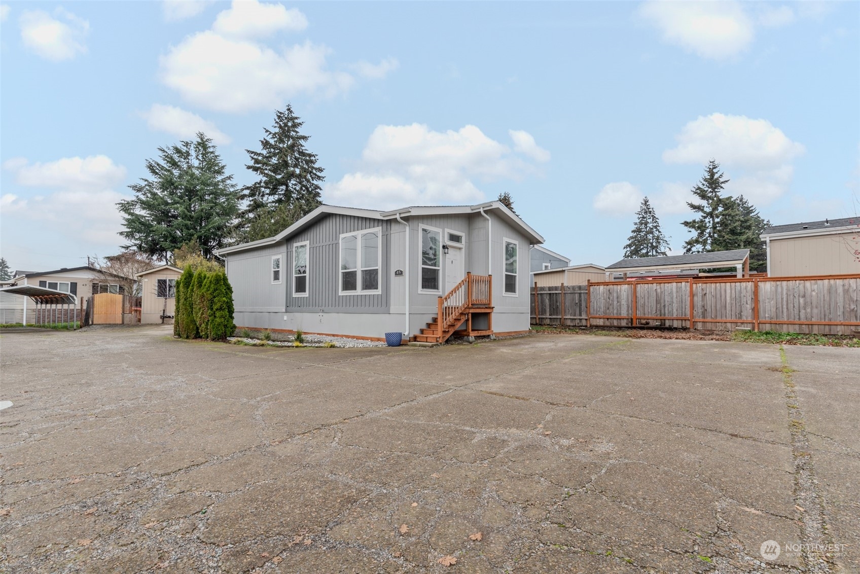 9811 Southwest Herman Road, Unit 45 Tualatin, OR 97062 - Photo 28 of 28 a view of a house with backyard and a tree