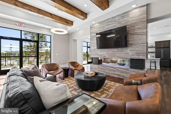 a living room with furniture fireplace and flat screen tv