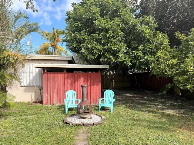 a view of a bench in a backyard