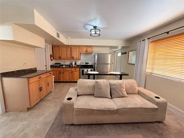 a living room with furniture and a window
