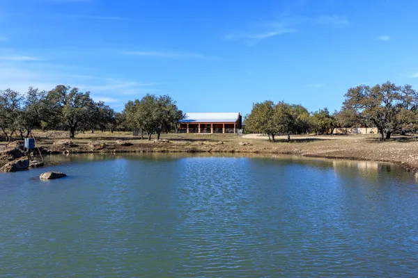 a view of swimming pool with outdoor seating and yard