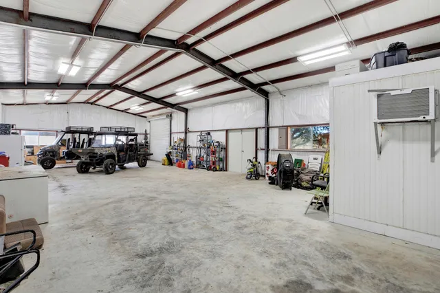 a view of car garage with cars