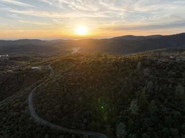 a view of a mountain from a yard